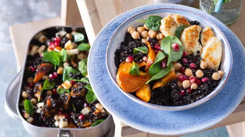 Colorful bowl with lentils and halloumi