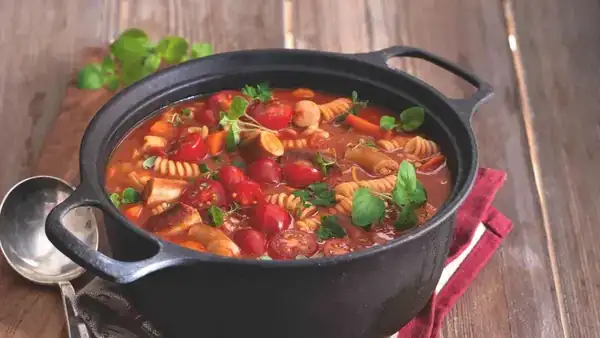 Wine sausage in tomato sauce with pasta