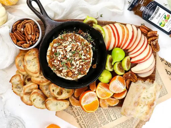Baked Brie with figs, thyme and pecans